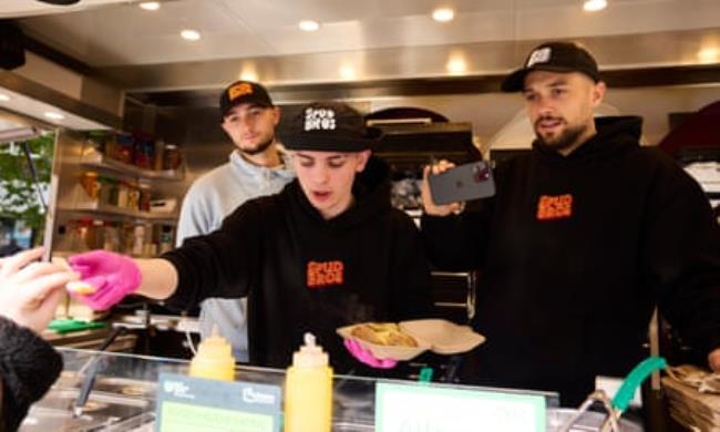 Jacob (right) and Harley (left) Nelson, known as the Spud Bros, whose livestreamed videos of them selling baked potatoes in Preston city centre have been viewed millions of times.