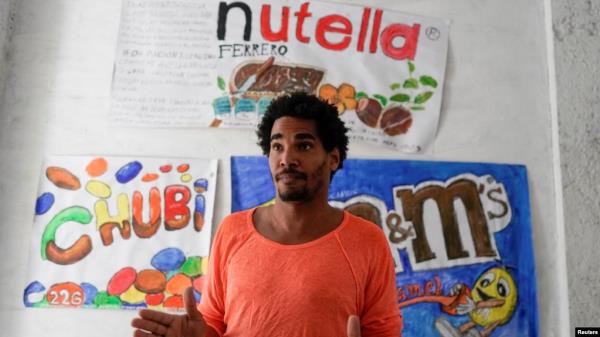 FILE - Dissident artist Luis Manuel Otero Alcantara speaks during an interview in Havana, Cuba, April 6, 2021.