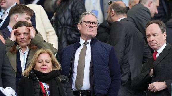 Sir Keir Starmer in the stands of Premier League match between Brighton and Arsenal in April. Pic: PA