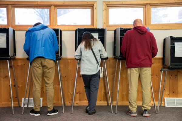 People vote in the U.S. presidential election on Election Day at Sawyer County's Hayward City Hall polling location in Hayward, Wisconsin, U.S., November 5, 2024. REUTERS/Erica Dischino