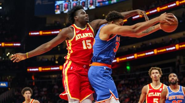 Atlanta Hawks center Clint Capela (15) attempts to get the rebound against New York Knicks center Karl-Anthony Towns, right, during the first half of an NBA basketball game, Wednesday, Nov. 6, 2024, in Atlanta.