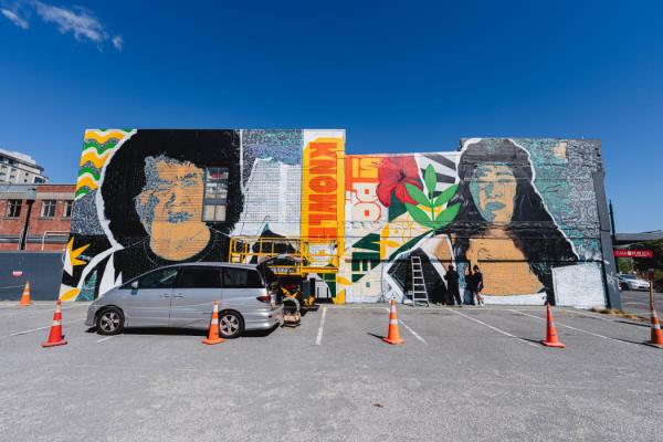 A new mural by artist Kophie Su’a-Hulsbosch in Ōtautahi, Christchurch stands as a vibrant tribute to the resilience and strength of Pacific communities affected by the Dawn Raids.