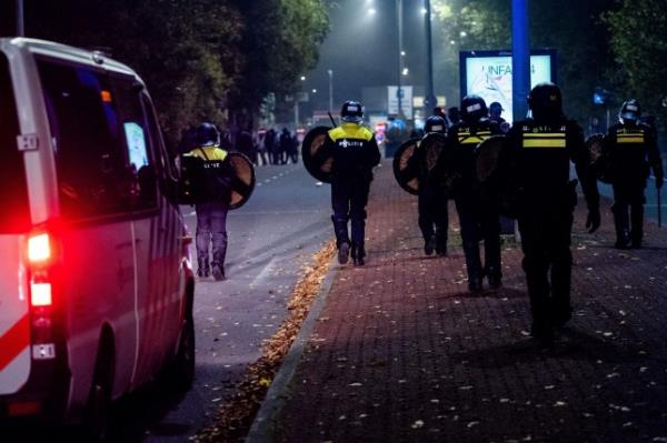 Mandatory Credit: Photo by Hollandse Hoogte/Shutterstock (14880369k) AMSTERDAM - Police officers from the Mobile Unit (ME) during a pro-Palestinian demo<em></em>nstration during Ajax - Maccabi Tel-Aviv at Anton de Komplein. Originally, the demo<em></em>nstration was planned at the Johan Cruyff Arena, but that was prohibited by the municipality. The latter decided that the area is a security risk area. Pro-Palestinian Demo<em></em>nstration at New Location in Amsterdam After Arena Ban - 07 Nov 2024