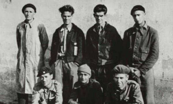 A black and white photo of seven New Zealand and Australian Internatio<em></em>nal Brigadiers awaiting repatriation from Spain