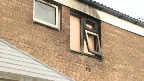 A burnt out window of the fire-destroyed flat