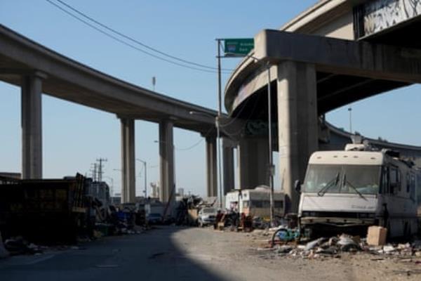 In July, a homeless encampment is seen in Oakland, California, as Governor Gavin Newsom issued an order on removing such encampments. California has the largest unsheltered homeless population in the U.S.