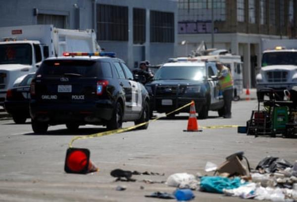 Oakland police at the scene of a homeless encampment sweep along East 12th Street near 16th Avenue in Oakland, Calif., on Wednesday, May 15, 2024.