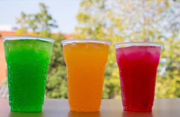 Flavored water drinks in cups with ice