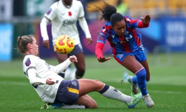 Ashleigh Weerden of Crystal Palace is tackled by Everton’s Heather Payne in their WSL match in November 2024 at Sutton