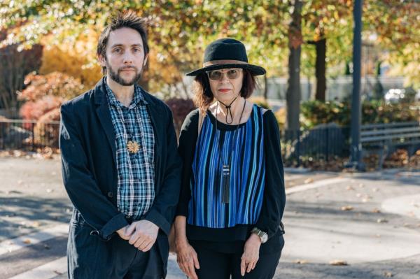 Michael Perlman and Gloria Nash stand in the park.